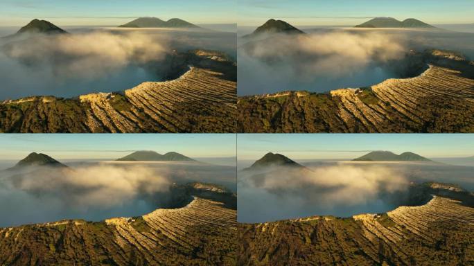 鸟瞰图环绕卡瓦伊真火山，火山口上有烟雾，绿松石湖，印度尼西亚爪哇一座活火山的硫磺开采