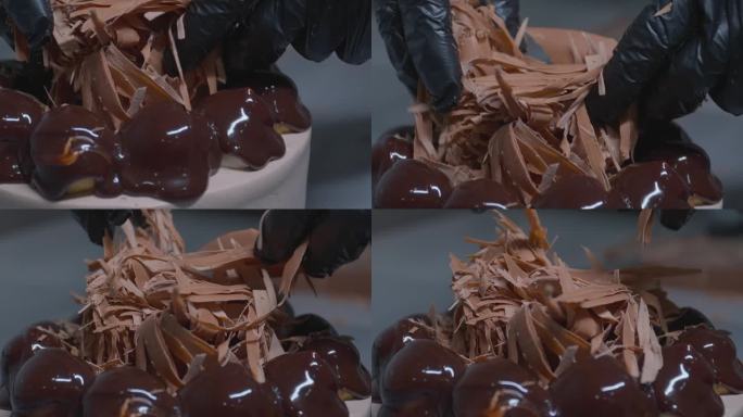 男人用巧克力装饰蛋糕的顶部