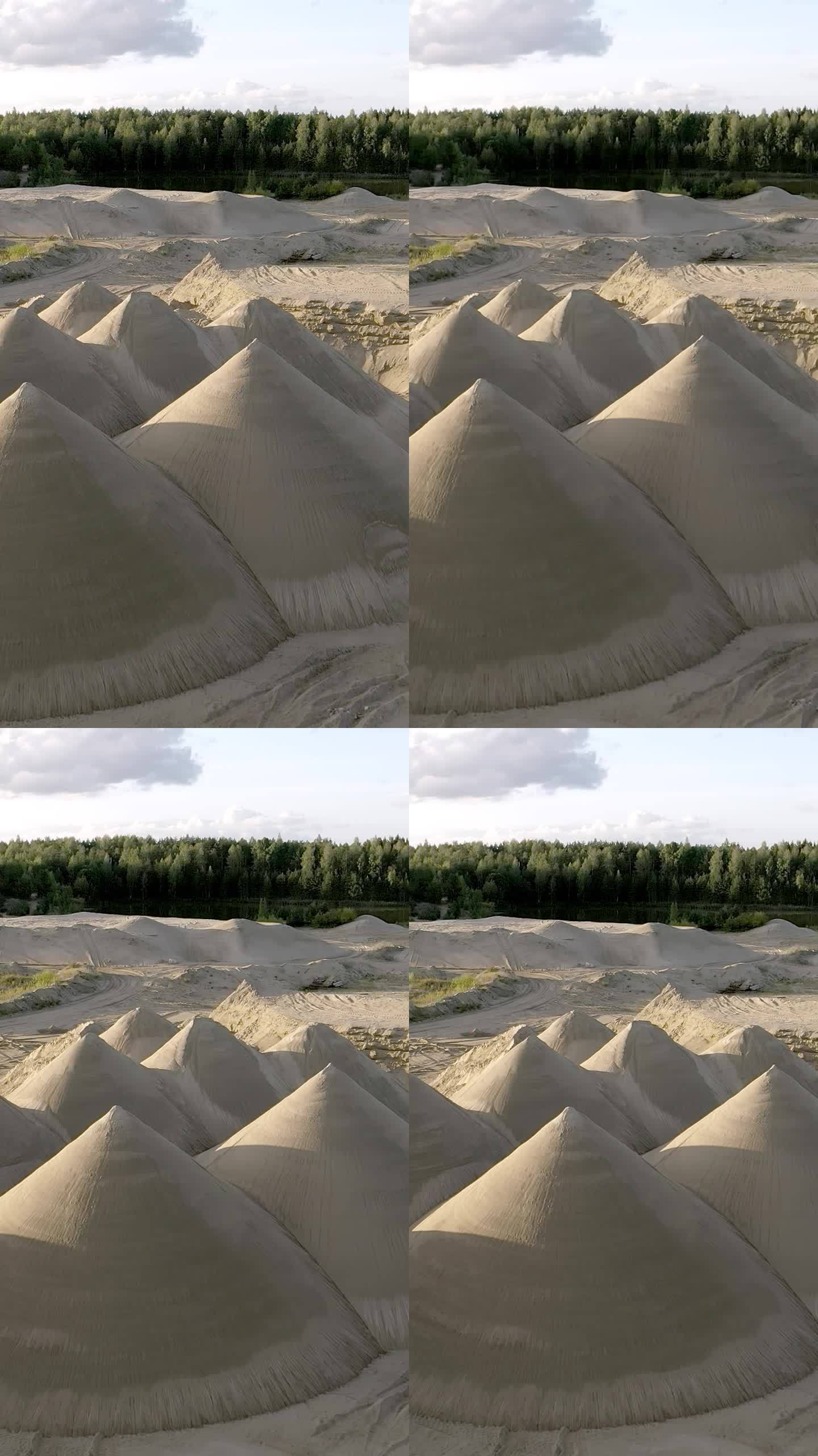 矿区的沙堆。镜头从左向右缓慢移动。垂直拍摄