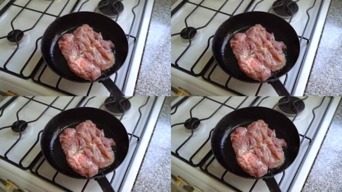 白肉在热油锅里煨着。手持，旋转，慢动作