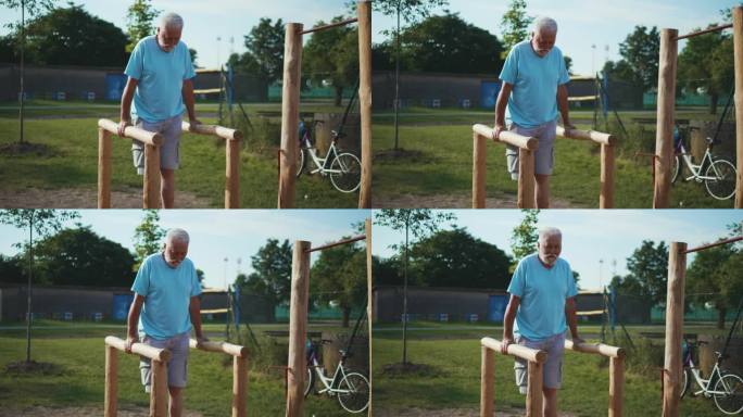 70多岁的老人在生态木制的户外健身房里努力做静态引体向上。爷爷在户外健身房里锻炼。