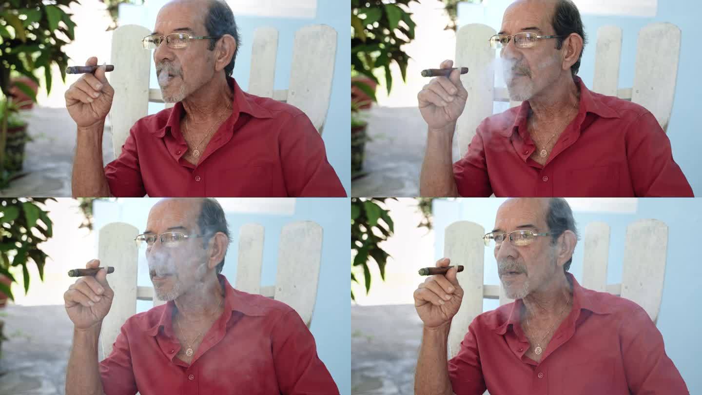 西班牙裔老人抽着传统古巴雪茄的肖像