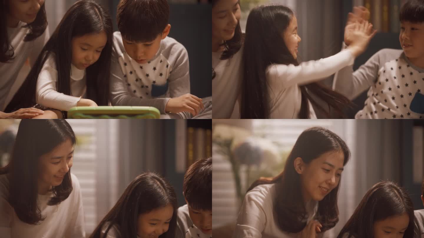 一个韩国小弟弟和妹妹在平板电脑上一起玩的照片。美丽的年轻母亲看着她的孩子如何成长，用科技学习新技能