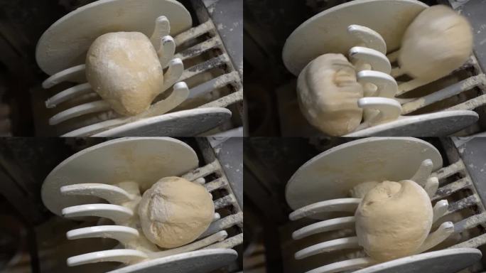 工业烘焙生产线上新鲜面团的特写镜头-慢动作视频