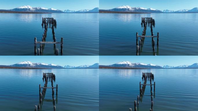 智利麦哲伦纳塔莱斯港的著名码头。雪山。湖的风景。Magallanes智利。水的背景。智利麦哲伦纳塔莱