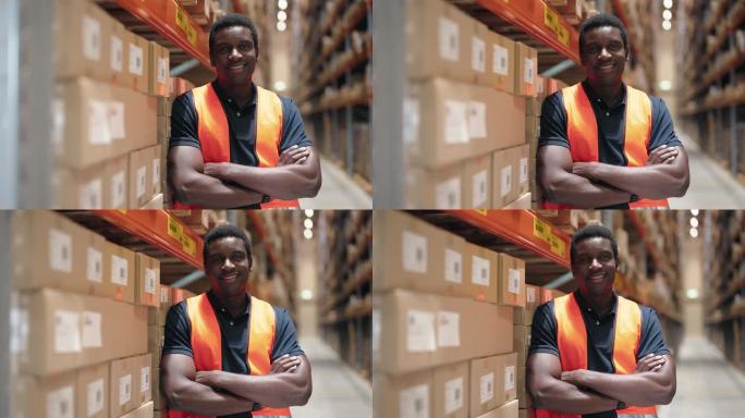 在配送仓库工作的微笑的年轻非洲员工