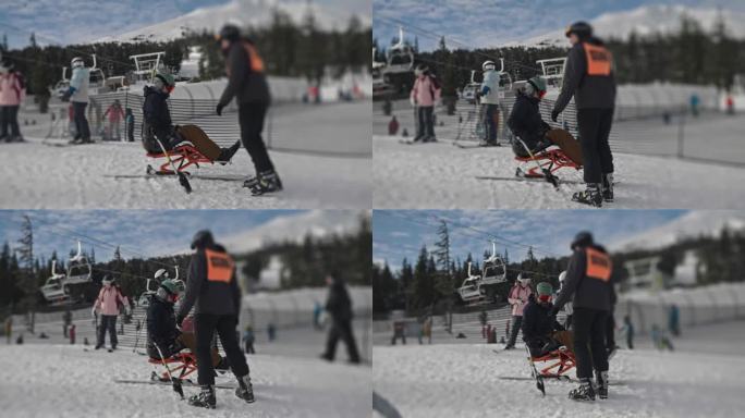 适应性运动员使用坐式滑雪倒车上山