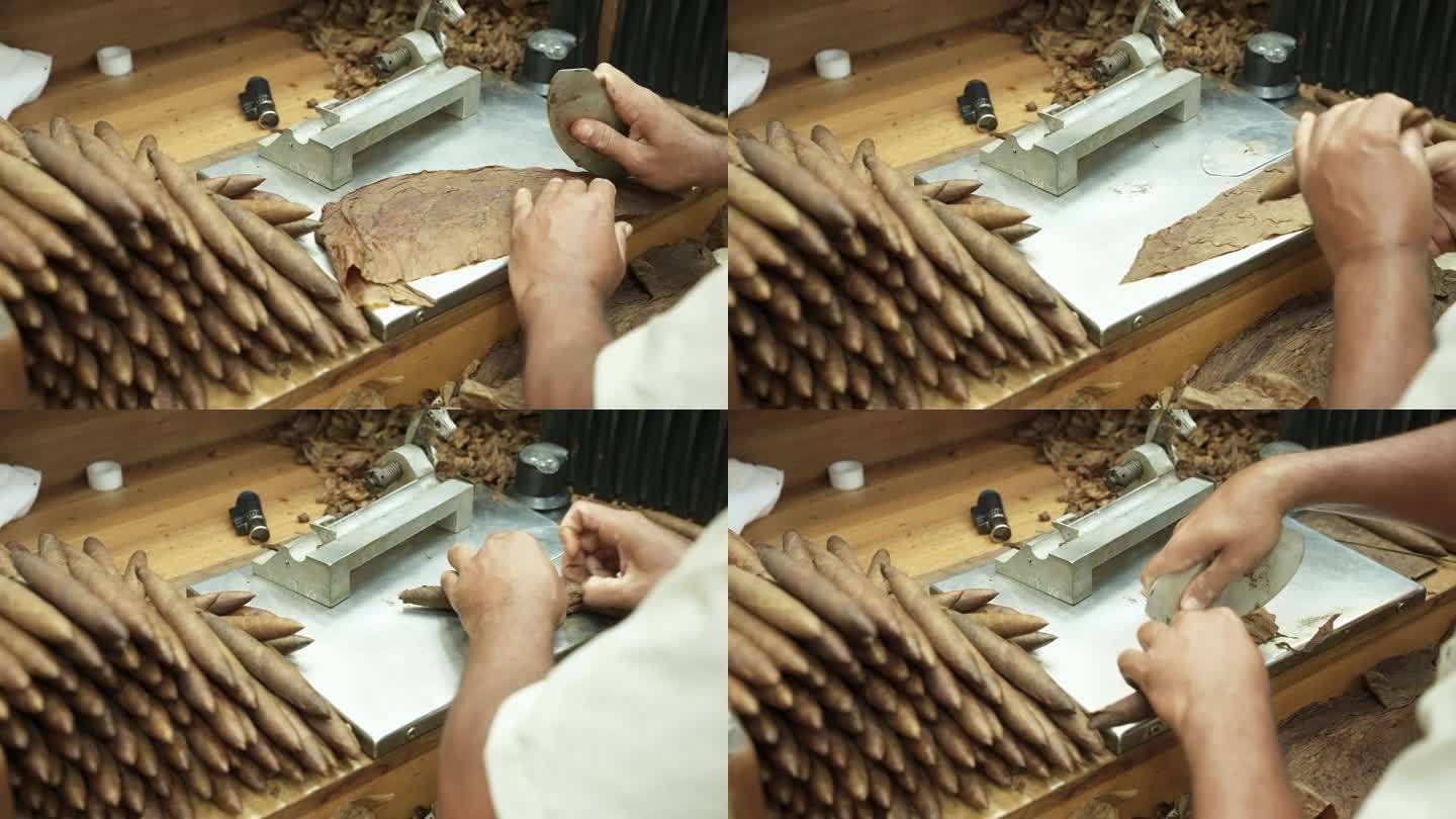 在卷烟厂的桌子上，男性用干烟叶制作雪茄的全过程特写。切、扭、粘。叠好的手工成品。60fps 4k镜头