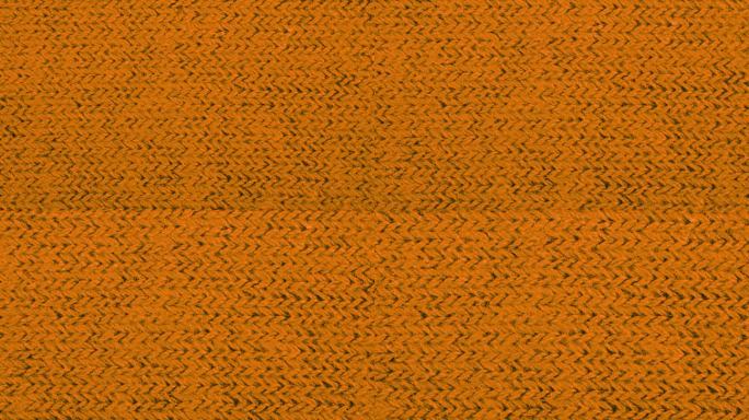 橙色纹理织物布料特写，纺织品背景。朝向观众的移动。宏变焦。