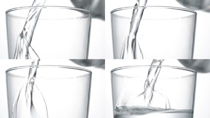 把瓶装水倒进杯子里。
