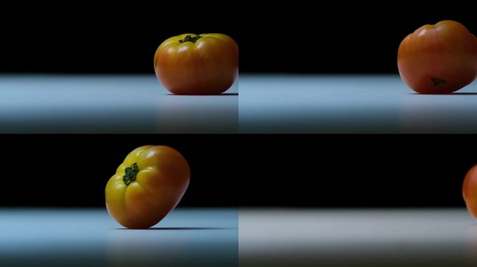 黑色背景的传家宝番茄。慢镜头拍摄细节。