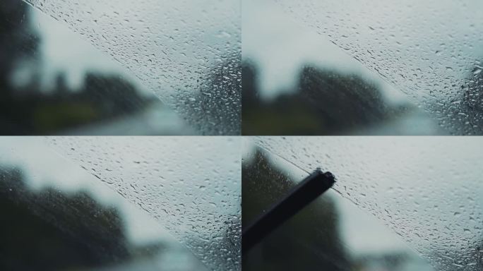 汽车雨刷把车窗上的雨滴洗掉。慢镜头拍摄