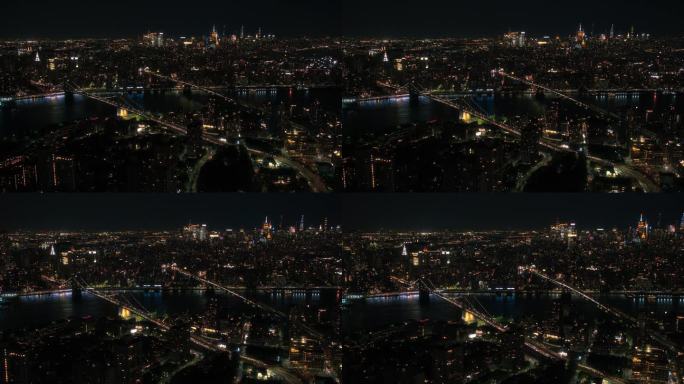 东河上的标志性纽约市夜生活景观，有摩天大楼、曼哈顿和布鲁克林大桥、汽车和渡轮。电影之夜城市天际线与办