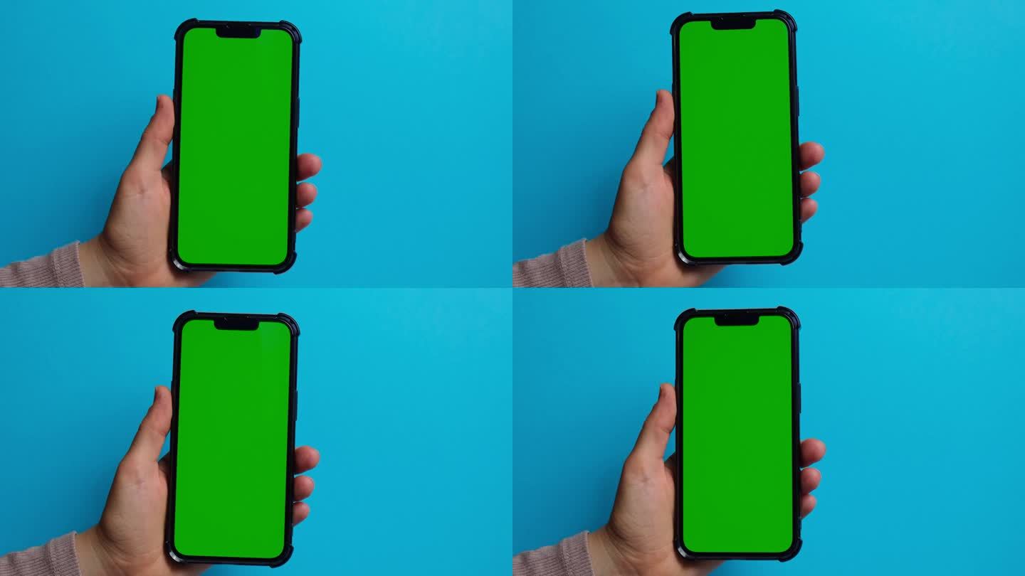 手握蓝屏绿屏手机。色度键模拟。你的产品的手机模型。技术手机触摸信息移动应用程序