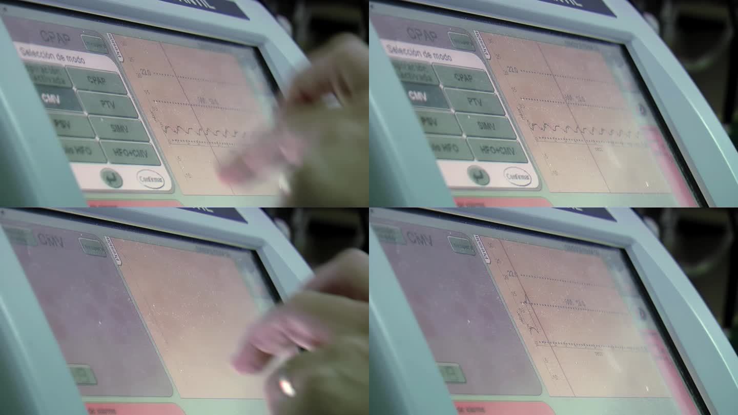 医院新生儿重症监护病房，医生的手按下呼吸机监护仪触摸屏菜单上的按钮。特写，4K分辨率。