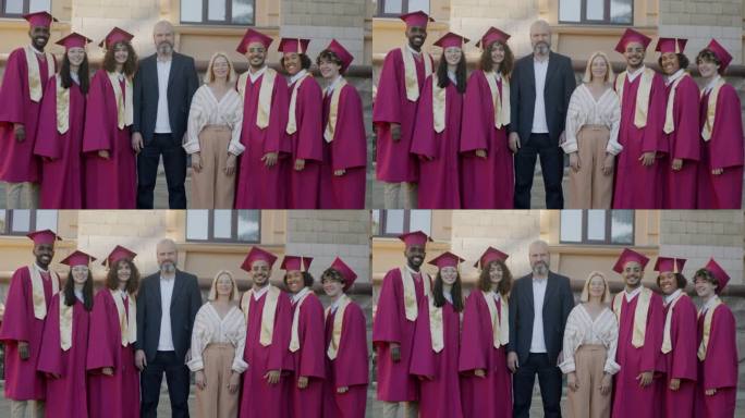 身着毕业礼服、头戴毕业帽的不同学生和老师站在大学校园的户外，面带微笑