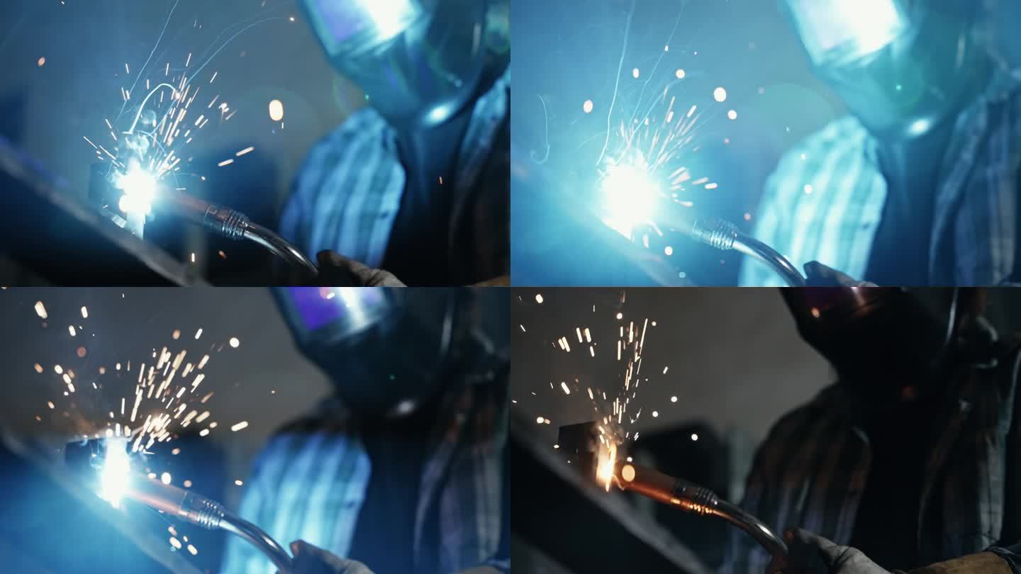SLO工人在工厂里用焊枪焊接冒着火花和烟的金属