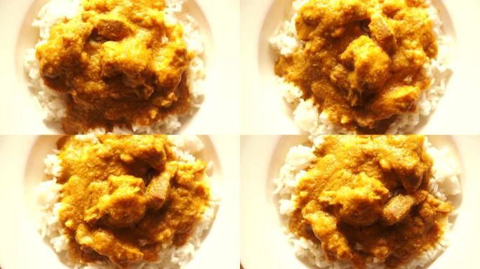 盘子里的咖喱鸡配米饭