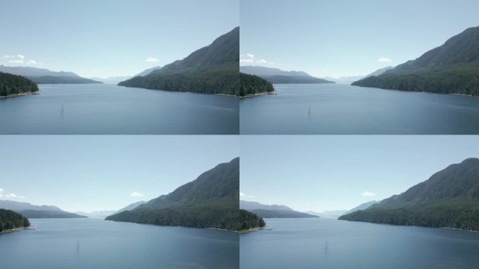 无人机拍摄的湖泊被森林和山脉包围