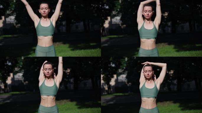 日落时分站在公园里的女孩在跑步前伸展和热身。健康的运动妇女伸展她的身体做瑜伽热身。穿着运动服的女孩在