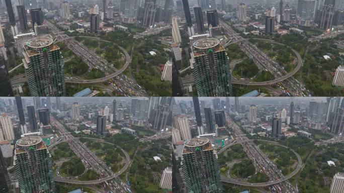 白天飞行在雅加达市中心的交通街道道路交汇处空中俯视全景4k延时拍摄印度尼西亚