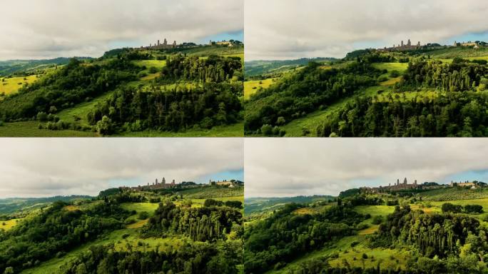 无人机视角下连绵起伏的绿色乡村山丘。圣吉米亚诺意大利托斯卡纳