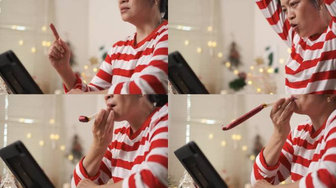 亚洲女性在家中观看直播新年烟花虚拟活动时，用派对喇叭倒计时