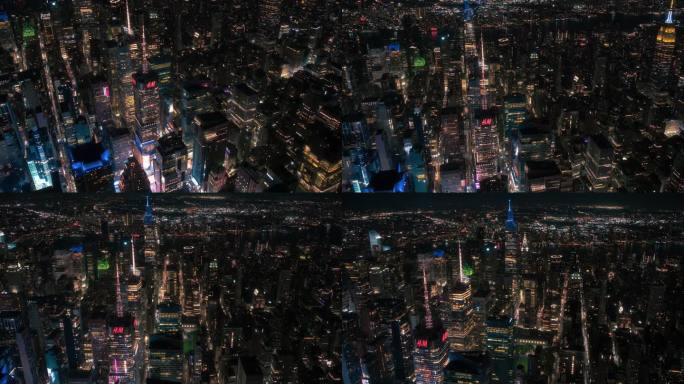 晚上的纽约混凝土丛林。从直升机环游大苹果的航拍画面。娱乐区和时代广场周围的现代摩天大楼