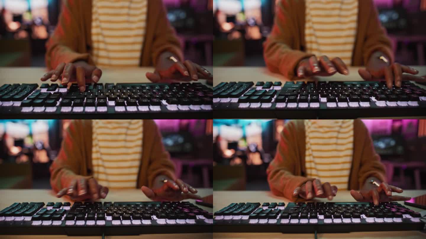 监视器的视角:黑人妇女的手在键盘上工作的特写镜头。在创意游戏开发或动画机构工作的女性女销售经理制定时