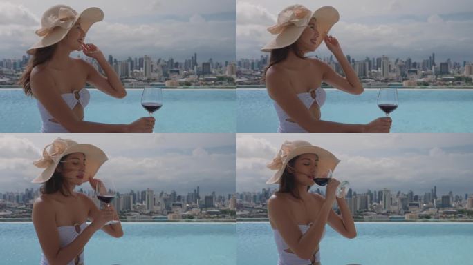美丽的亚洲女性游客在酒店的屋顶感到快乐和自由。