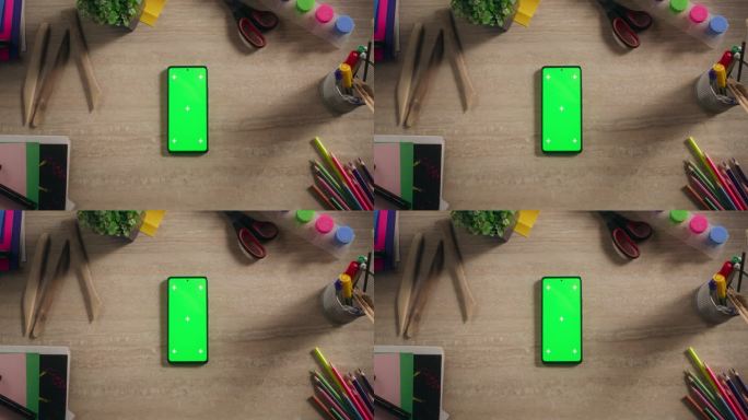 一个智能手机与模拟绿色屏幕Chromakey显示与运动跟踪占位符的自上而下的视图。一个手机设备与设计