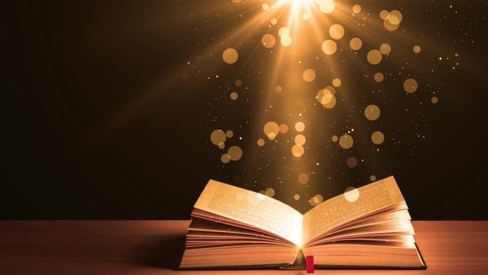 发光的光耀斑和飞行粒子的童话书。魔法童话书在木桌上