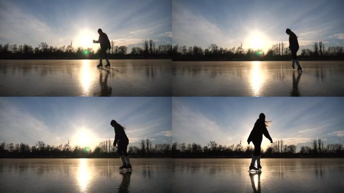 年轻女子正在滑冰。女孩在冰冻的湖泊或河流上独自训练。女士在户外提高他的技能。耀眼的阳光反射在冰面上。