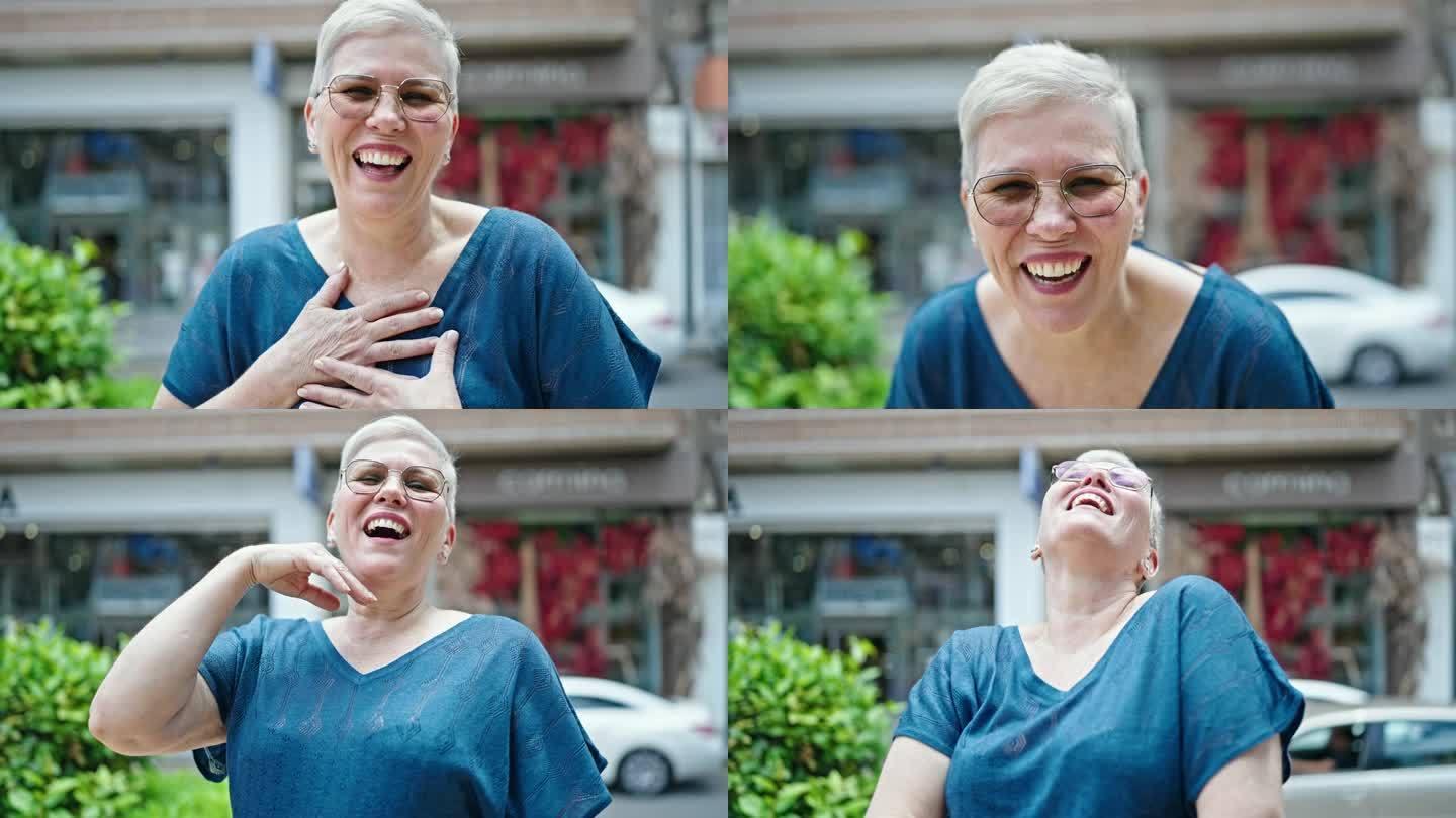 一个满头白发的中年女人在街上笑个不停