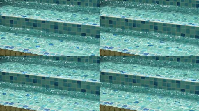 慢动作的蓝色游泳池与楼梯，淡水的背景