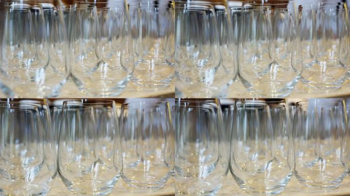 十几个空酒杯被精心地排列在吧台上。