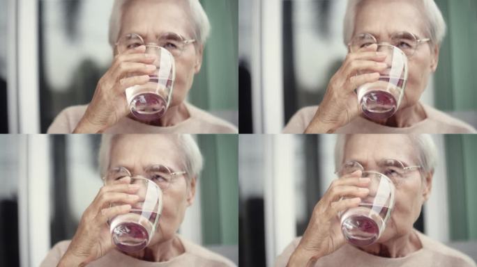 老年妇女喝水老人喝水特写视频素材