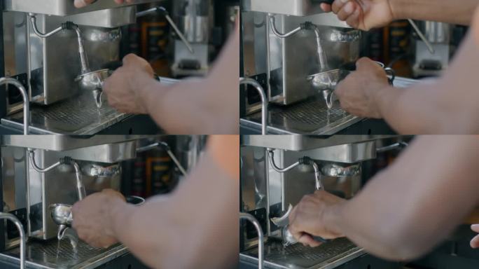 男咖啡师在咖啡馆用现代机器煮咖啡的特写