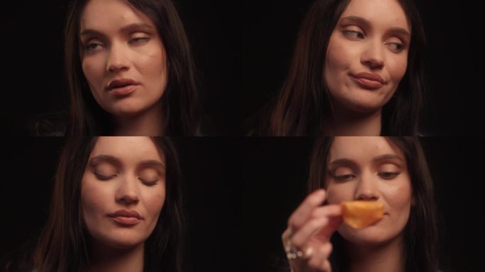 美女摄影棚拍摄，手里拿着一片美味的薯片笑着