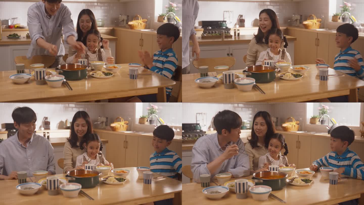 幸福的韩国四口之家在家里的厨房里一起享受美味的饭菜。他们正在分享一顿充满爱和关怀的传统大餐。孩子们为