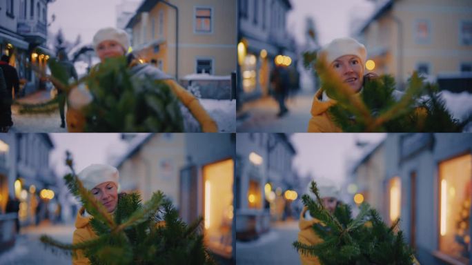 一名妇女扛着一棵圣诞树穿过朱利安阿尔卑斯山小镇的小巷