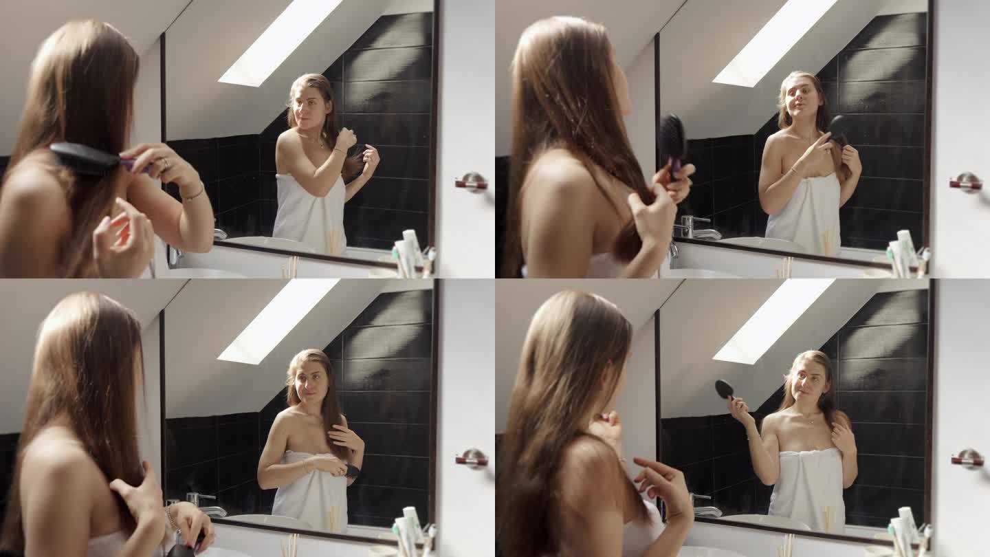 一个女人站在浴池里，用毛巾盖着，一边梳理她的长发，一边对着镜子欣赏自己。保持良好的卫生习惯和自我保健