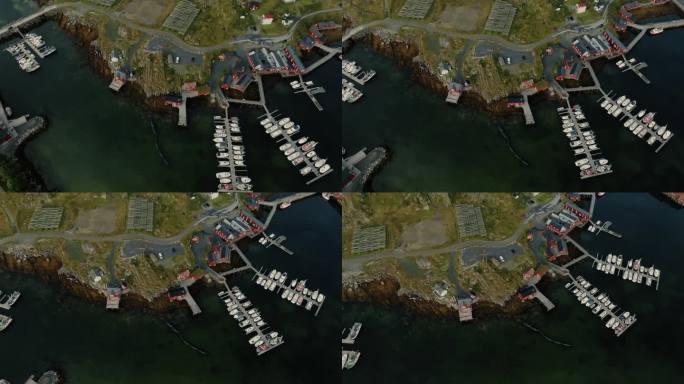 令人惊叹的鸟瞰图，船码头和岩石海岸与色彩缤纷的挪威rorbu房屋