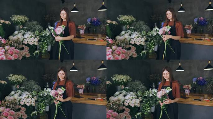 20多岁的花店女老板满怀爱意地制作花束，享受着他的工作。花艺，零售，小生意