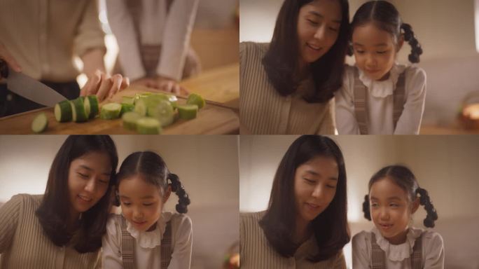 韩国妈妈和可爱的小女儿在家庭厨房一起做健康的晚餐。可爱的小女孩帮妈妈做沙拉。他们在交谈，建立感情