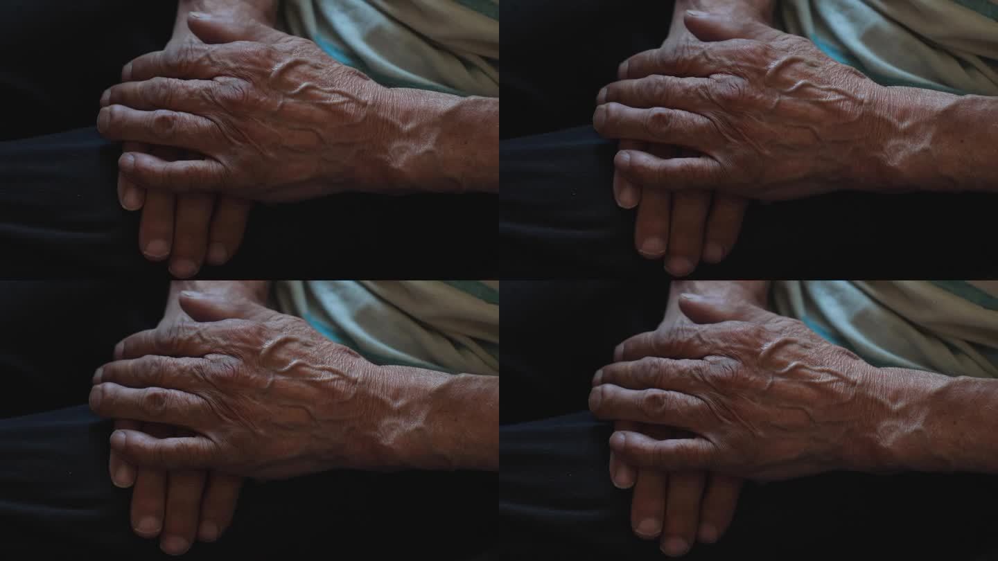 年迈父亲布满皱纹的双手，选择性的专注，退休老人手上的静脉和皱纹。概念老人，老年。