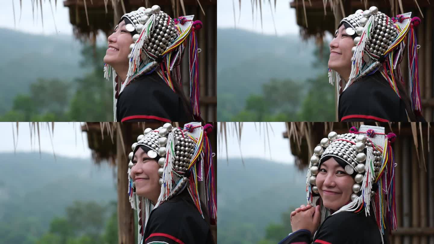 一个穿着阿卡传统服装的年轻女子看着美丽的大自然的慢动作