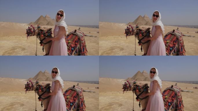 在埃及，一名年轻女子站在一头骆驼旁边。