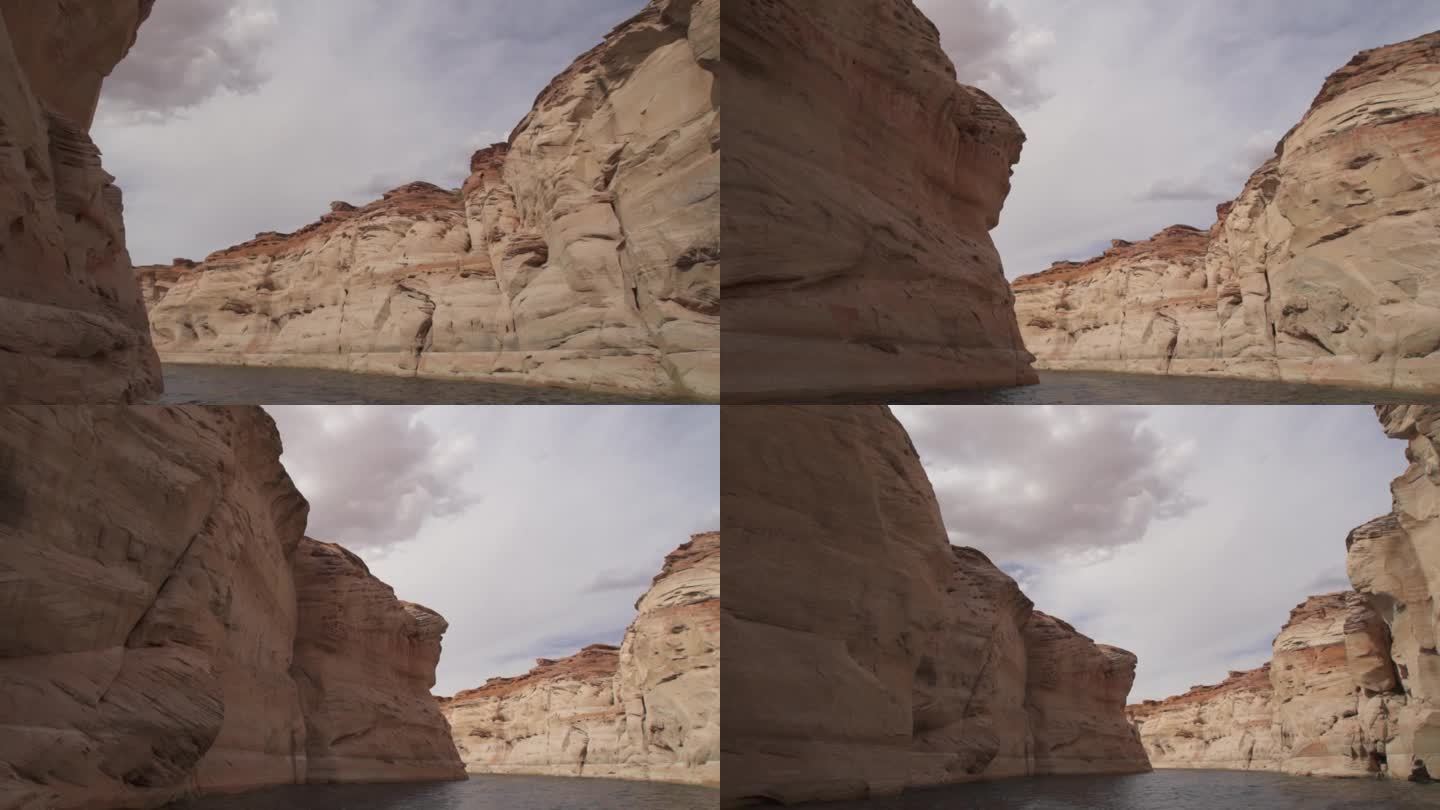 鲍威尔湖羚羊峡谷风景游船之旅通过水道狭窄，丰富多彩，并在亚利桑那州的岩石雕刻地质