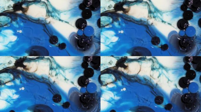 抽象艺术背景的蓝色和黑色的油漆泡沫破裂和漩涡